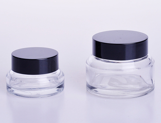 Cream jar with oblique shoulder in clear glass 